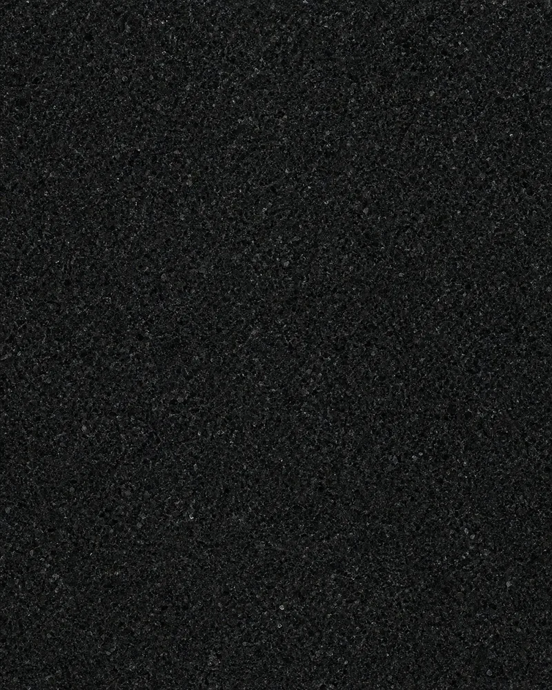 Representative charcoal-black granite with fine crystalline grain