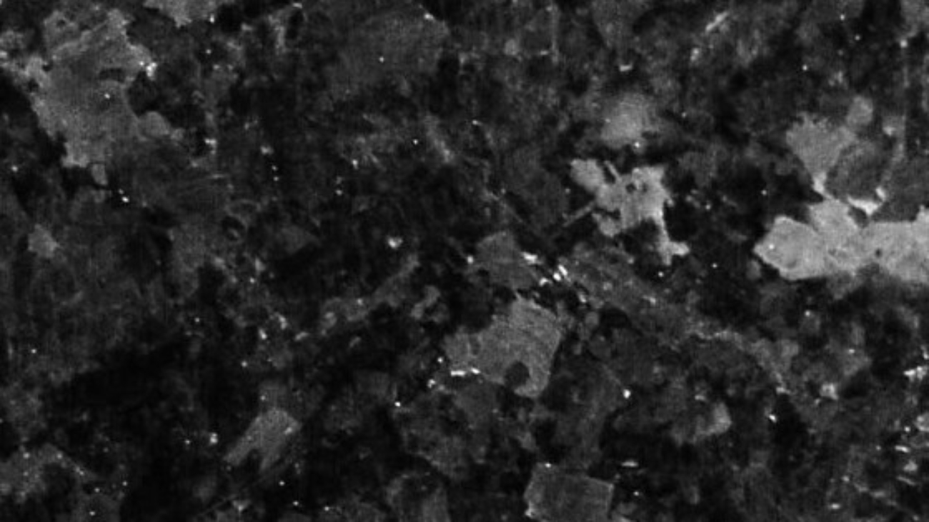Close-up of Black Labrador granite with broad reflective mineral crystals