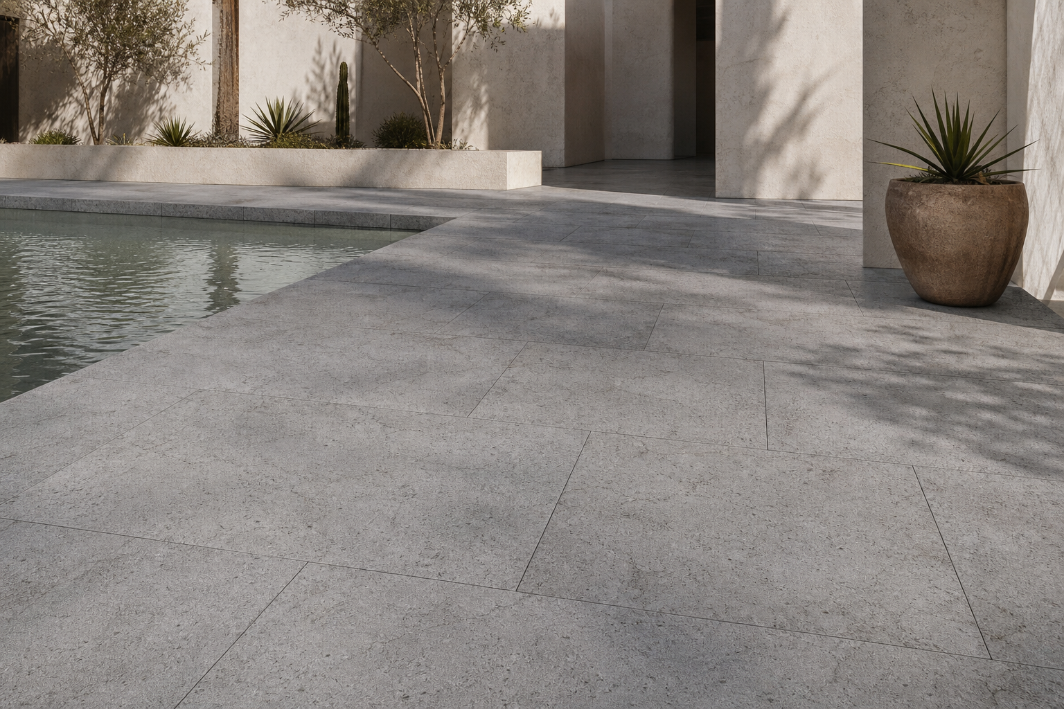 Touda Grey limestone paving around a contemporary courtyard pool