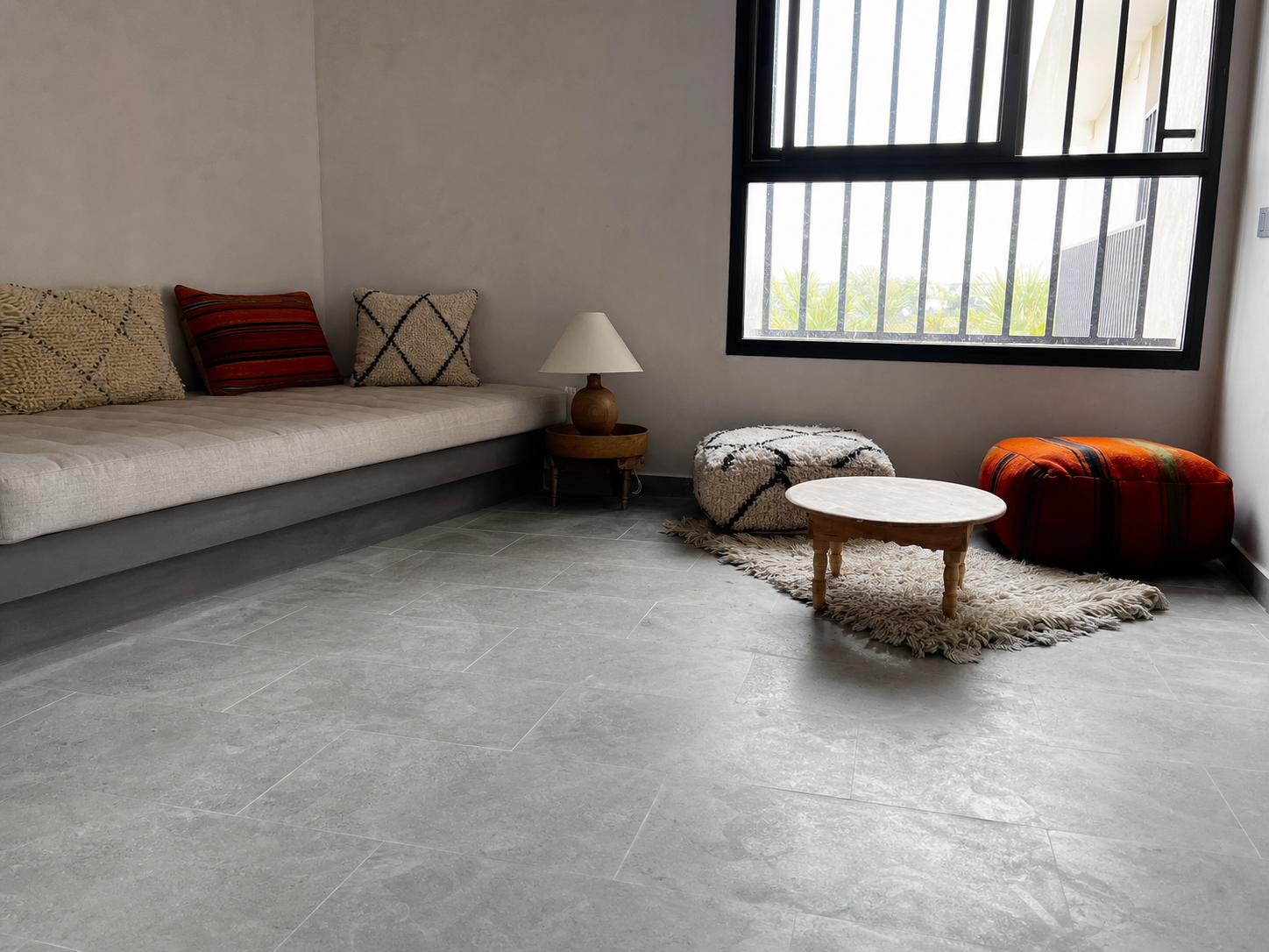 Window-side view across the grey limestone floor