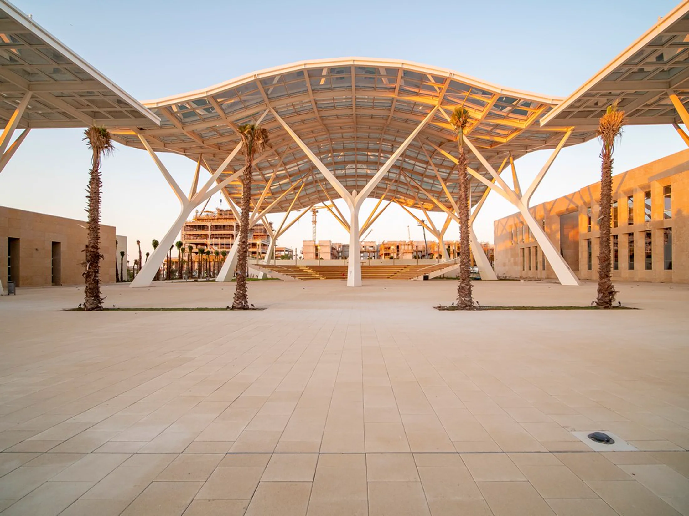 Covered central plaza at UM6P University Rabat with pale stone paving