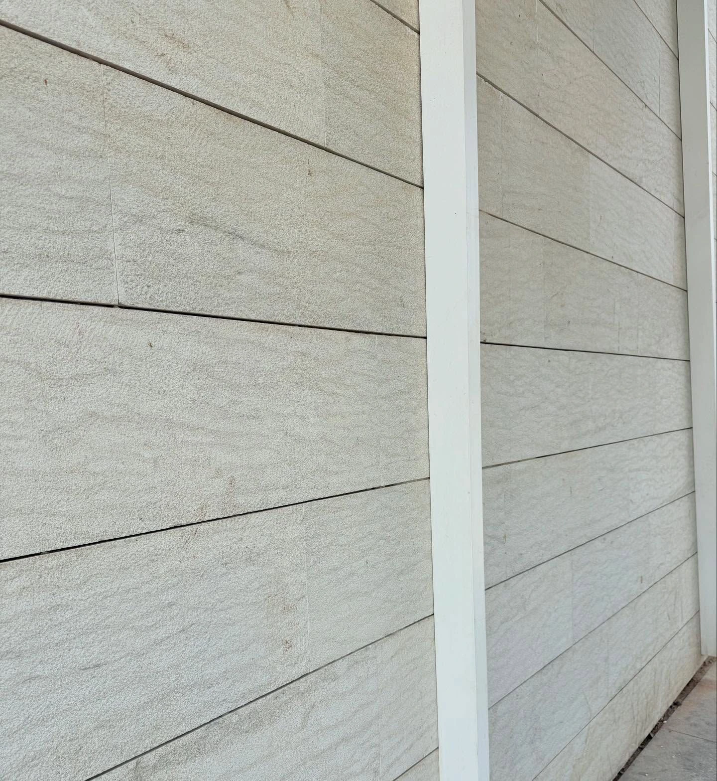 Avallon Grey sandblasted gross-cut walling installed in horizontal courses