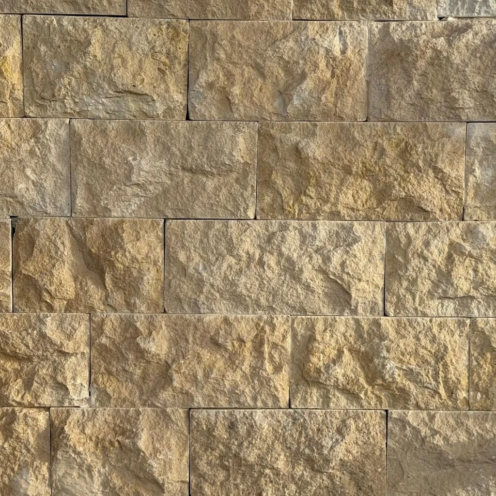 Chablis Beige rock-face limestone walling with a pronounced texture