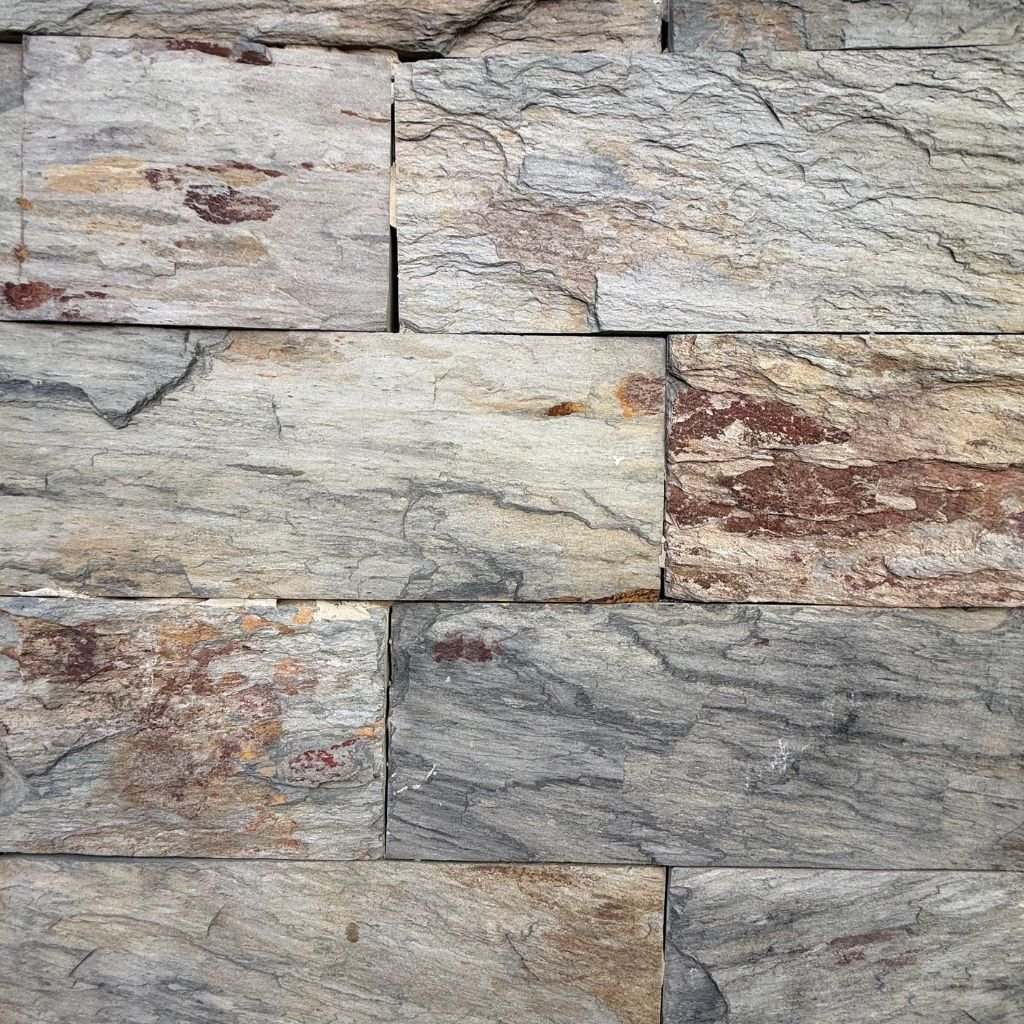 Natural slate walling in layered grey, ochre and earth tones