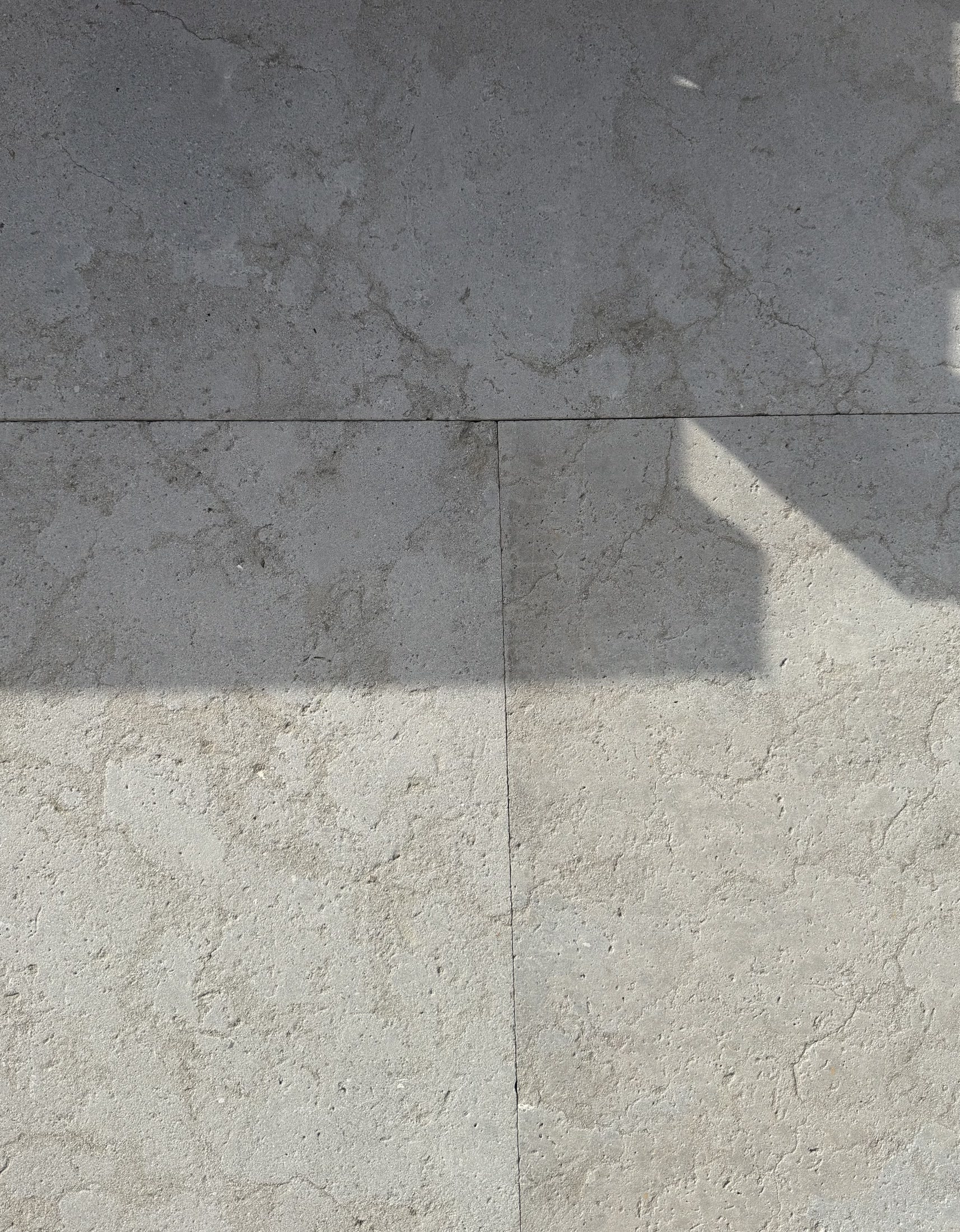Installed Touda Grey limestone paving with natural tonal variation