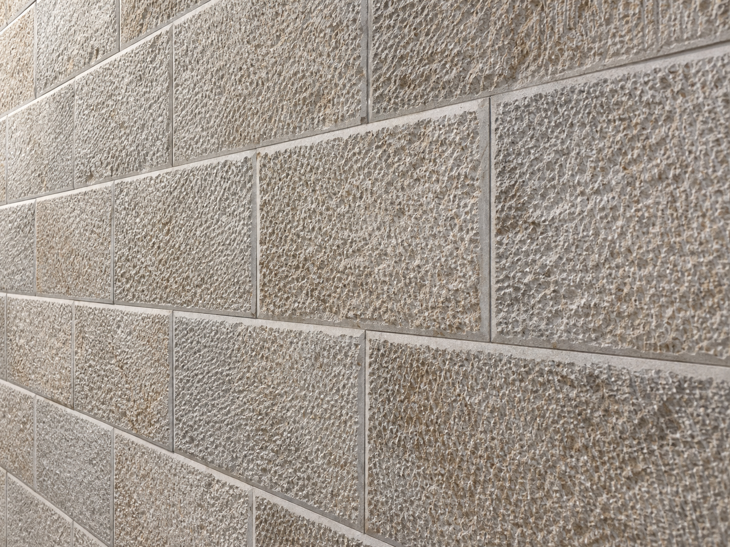 Oblique view of textured limestone walling