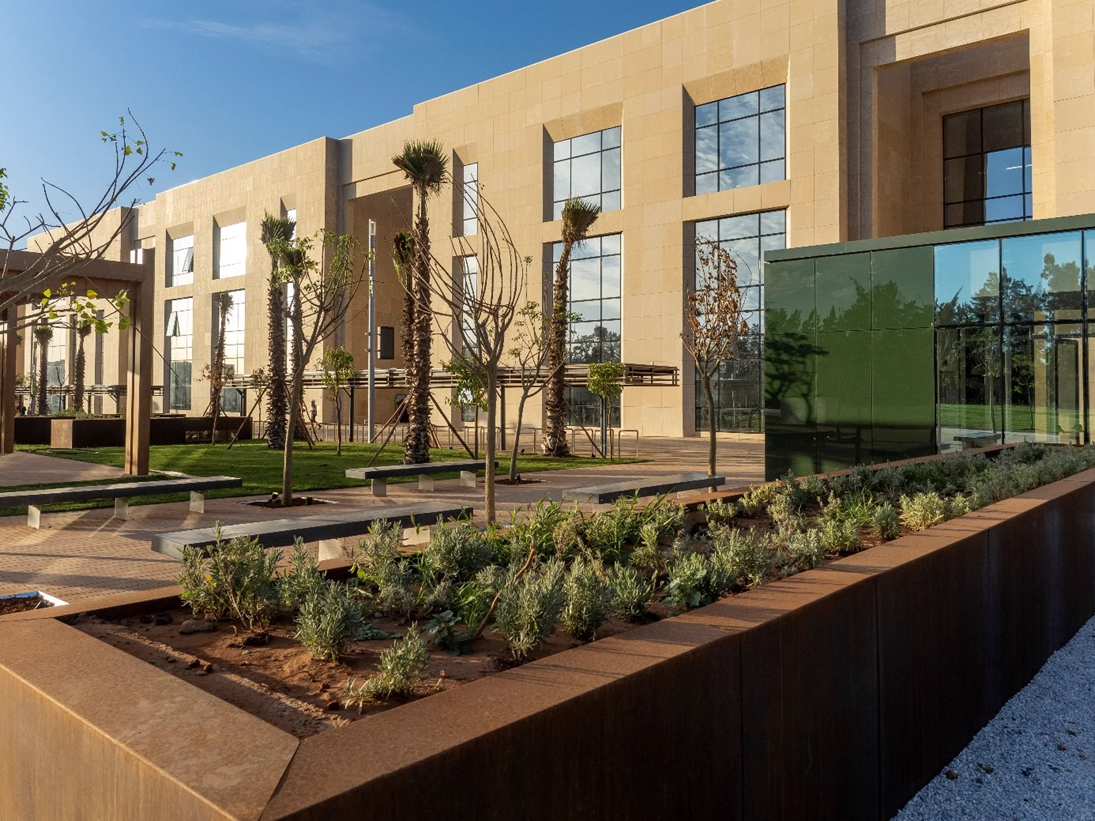 UM6P University Rabat campus exterior with beige stone façades and landscaped courtyard